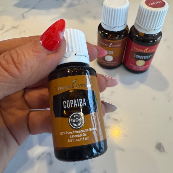 YOUNG LIVING BUNDLE OF 3 SIZE 15 ML EACH BRAND NEW LONGEVITY, CLOVE, COPIABA - Picture 2 of 4